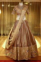 Chocolate Brown Munga Silk Woven Lehenga with Zardosi Beaded Work and Peacock Motif Broad Border
